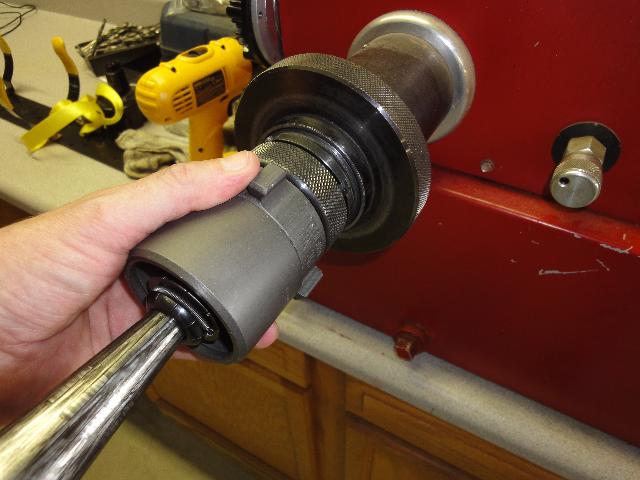 1-1/2" Couplingl Being Slid Onto Coupling Machine